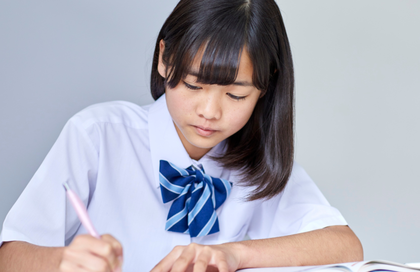 Japanese online learning classes with live virtual lessons, students studying Japanese language on laptop